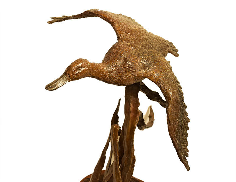 Dale M. Burr - Marsh Duster - bronze duck sculpture of available at Sculpture Collector