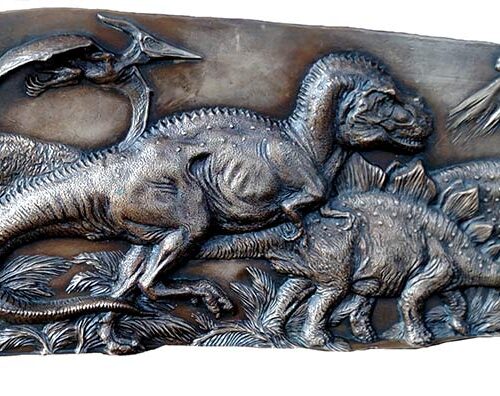 Dinosaurs on a bronze panel by John Bonnett Wexo