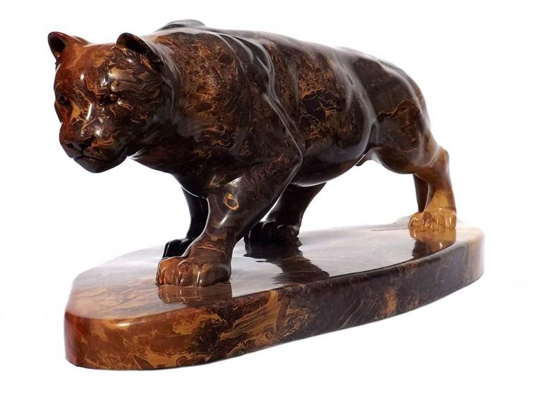 A Carved Stone Sculpture titled Stealth (Mountain Lion) by Gerald Sandau