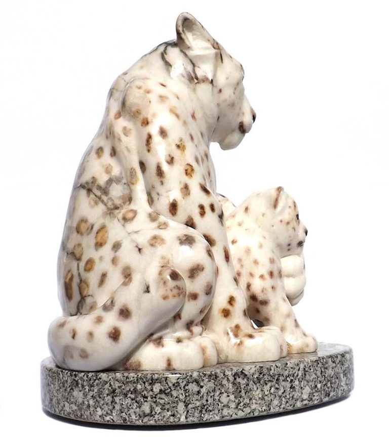 A Carved Stone Sculpture titled The Guardian (Snow Leopard & Kit) by Gerald Sandau