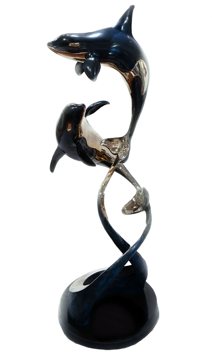 Two Orca's in a bronze sculpture titled Ocean Romance by Jason Napier