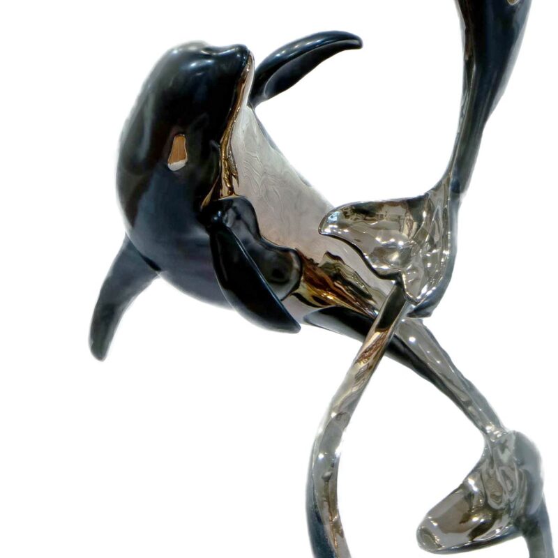 Two Orca's in a bronze sculpture titled Ocean Romance by Jason Napier