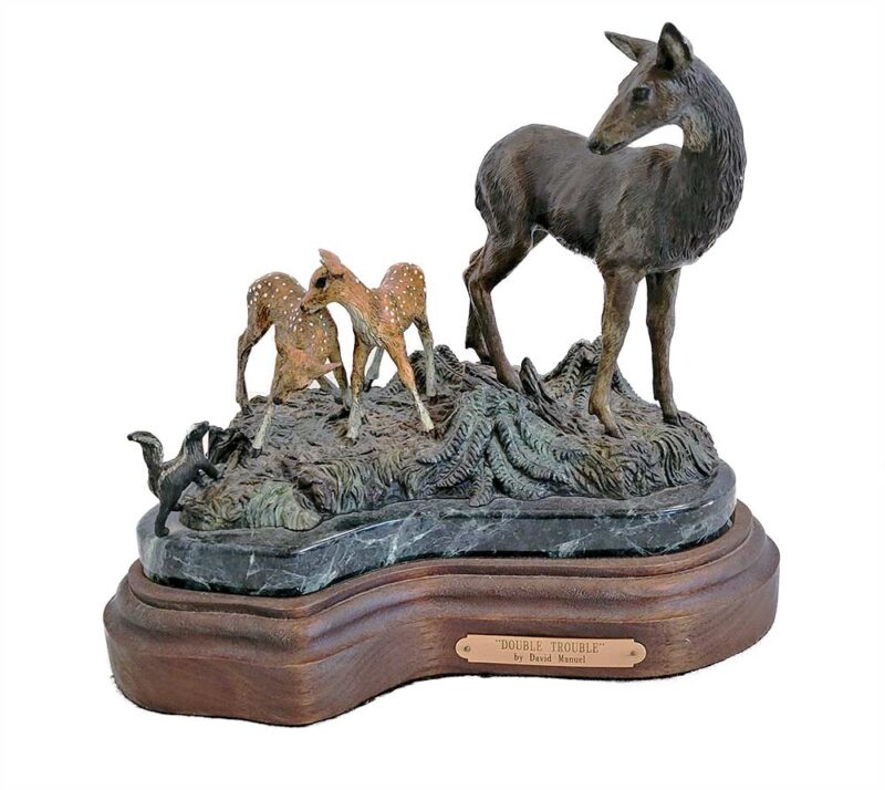 A limited-edition bronze sculpture of Doe (Deer) and her Fawns by noted sculptor David Manuel