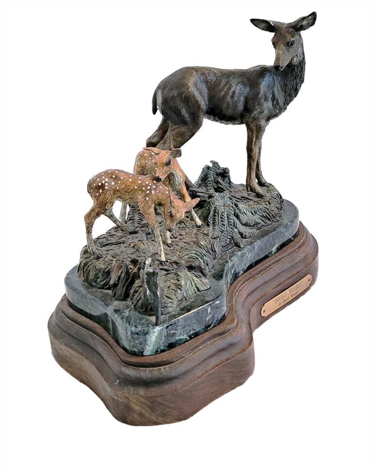 A limited-edition bronze sculpture of Doe (Deer) and her Fawns by noted sculptor David Manuel