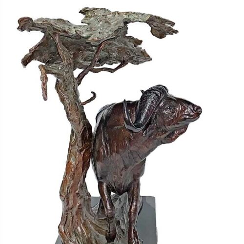 High Noon, a bronze sculpture of a Cape Buffalo under an Acacia Tree by noted wildlife artist Kent Ullberg