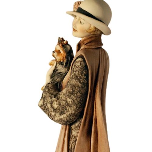 Lady in Tan Cape with Puppy a porcelain sculpture by Giuseppe Armani