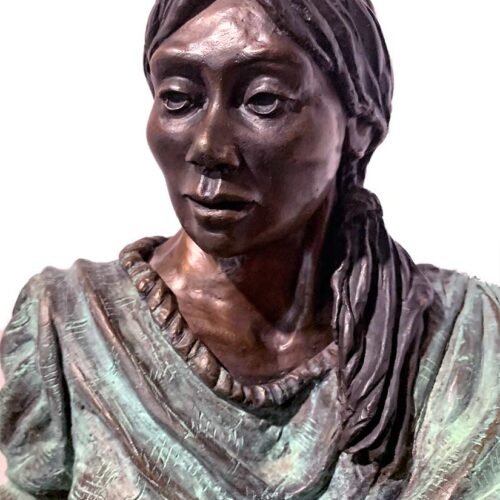 The Chili Peddler a bronze sculpture by artist Marie Barbera a native American woman selling peppers