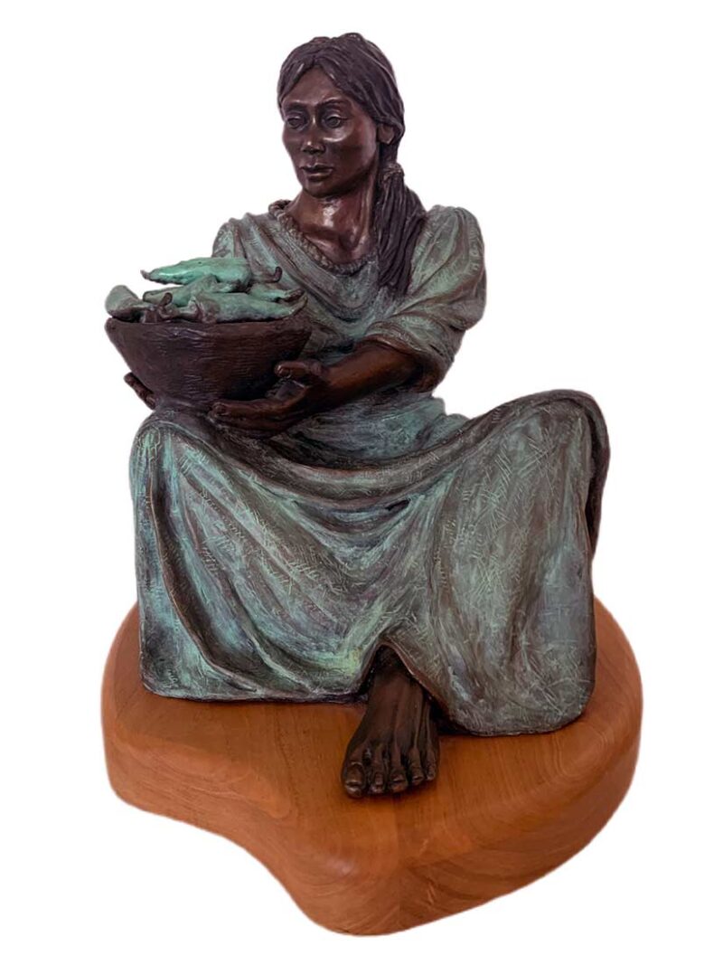 The Chili Peddler a bronze sculpture by artist Marie Barbera a native American woman selling peppers
