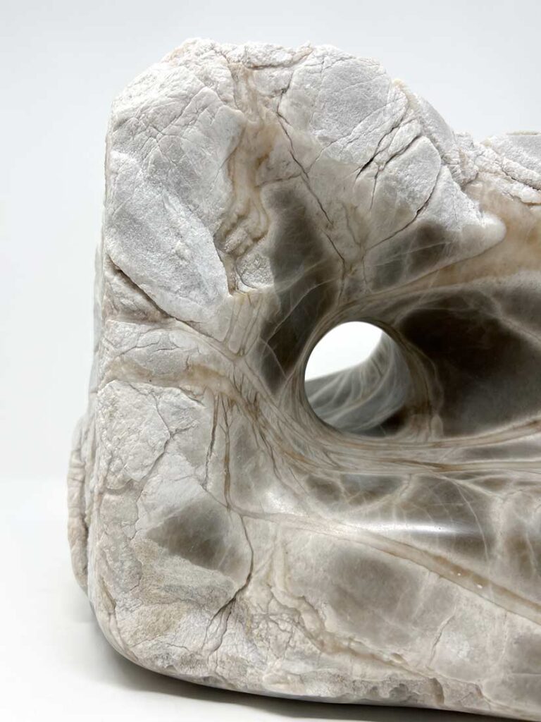 An elegant stone sculpture by noted sculptor-artist Michele Chapin
