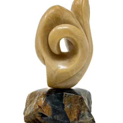 The Time Traveler carved Alabaster stone sculpture by noted sculptor-artist Michele Chapin