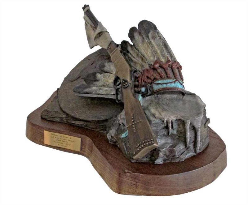 Defeat at Bear Mountain a limited edition bronze sculpture of discarded battle gear of Chief Joseph by Ed Swena
