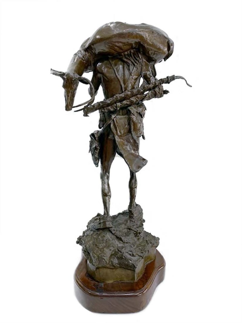 The Long Hunt a limited edition Native American bronze sculpture of an Indian hunter carrying his hunted deer