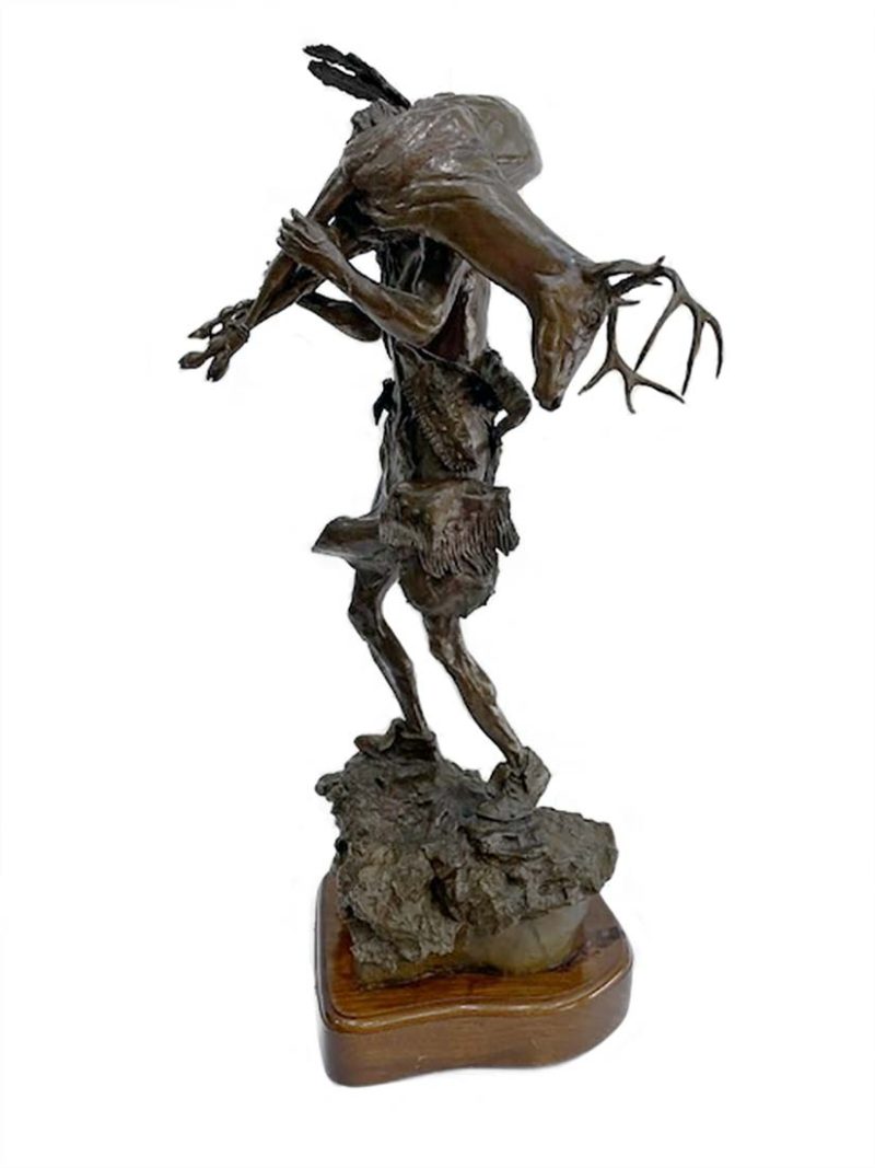 The Long Hunt a limited edition Native American bronze sculpture of an Indian hunter carrying his hunted deer
