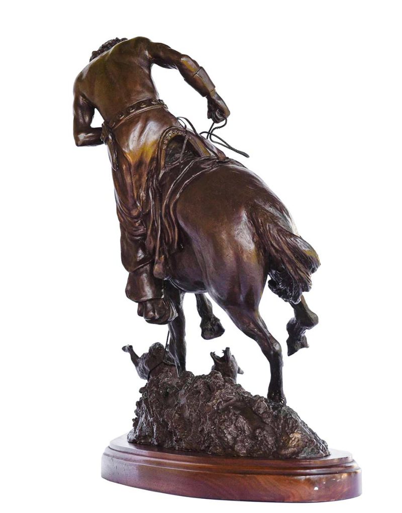 Bronze, "Tightened Play" by Jack Bryant. An Indian seated on a horse holds a lasso. The horse is pawing at a wolf (or some kind of animal) on the ground that the Indian has lassoed.
