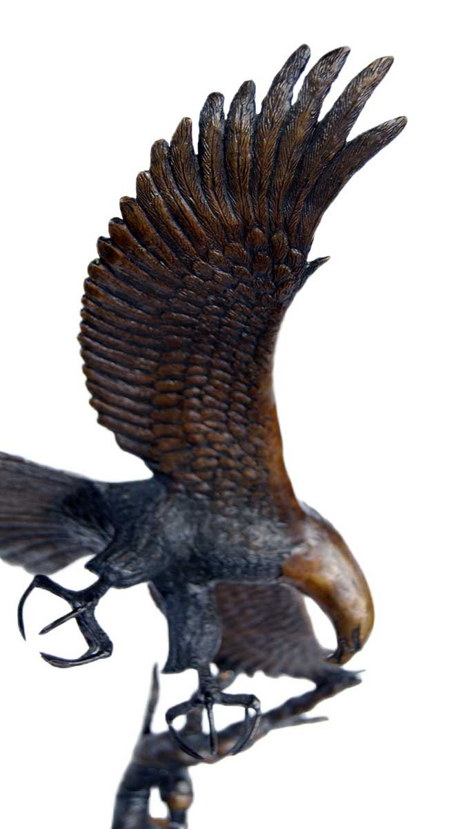 Eagle Descends on Rabbit Prey (TTB) a limited edition bronze Eagle sculpture by noted wildlife sculptor-artist R. Rousu