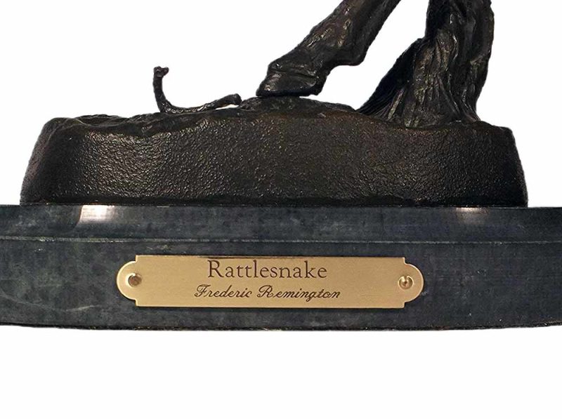 A nicely done Frederic Remington (restrike) bronze horse and Rider startled by a rattlesnake sculpture titled Rattlesnake
