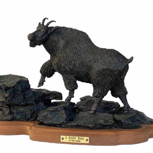 Bronze Mountain Goat sculpture by the late gifted sculptor-artist Carl Wagner, titled "A Rocky Road"