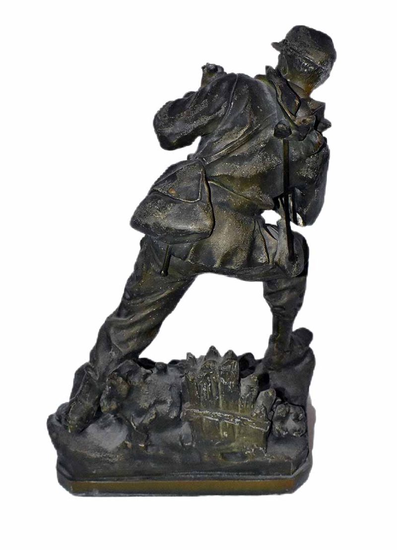 Figurative Army soldier in the ready stance. The artist is unknown. The bronze sculpture is titled Army.