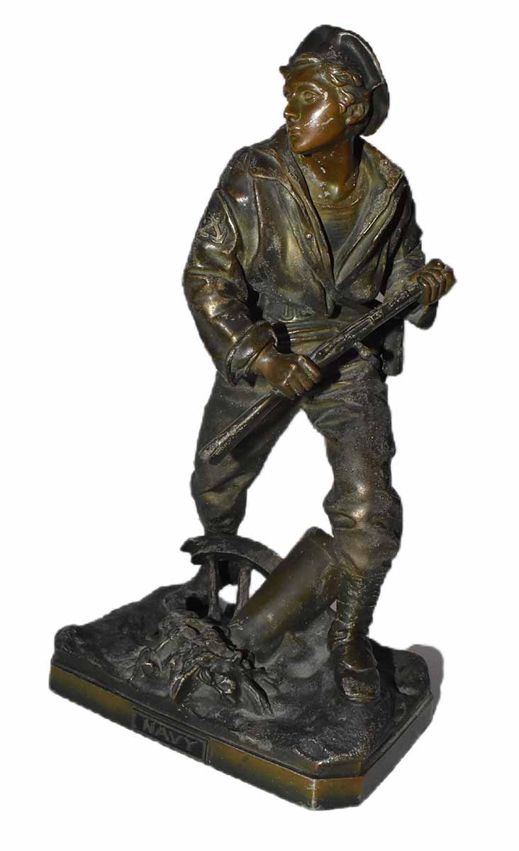 Figurative Navy sailor in the ready stance. The artist is unknown. The bronze sculpture is titled Navy
