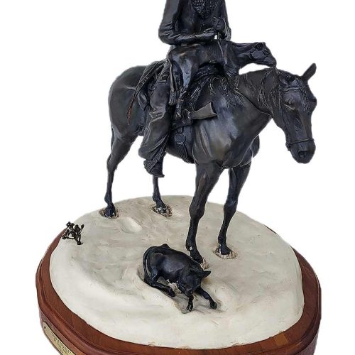 Double Trouble a limited edition bronze cattle rancher on horseback in the winter finding another calf needing rescue by noted sculptor-artist Bob Parks