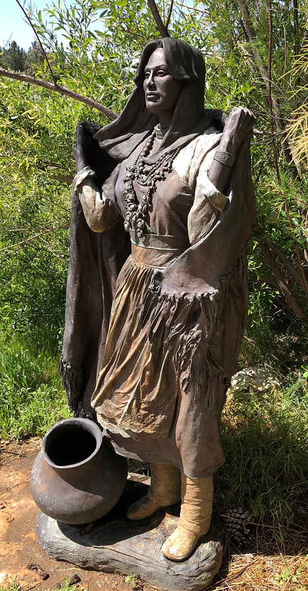 Winter Wind on the Mesa a life-size bronze Nativwe American sculpture by Marie Barbera