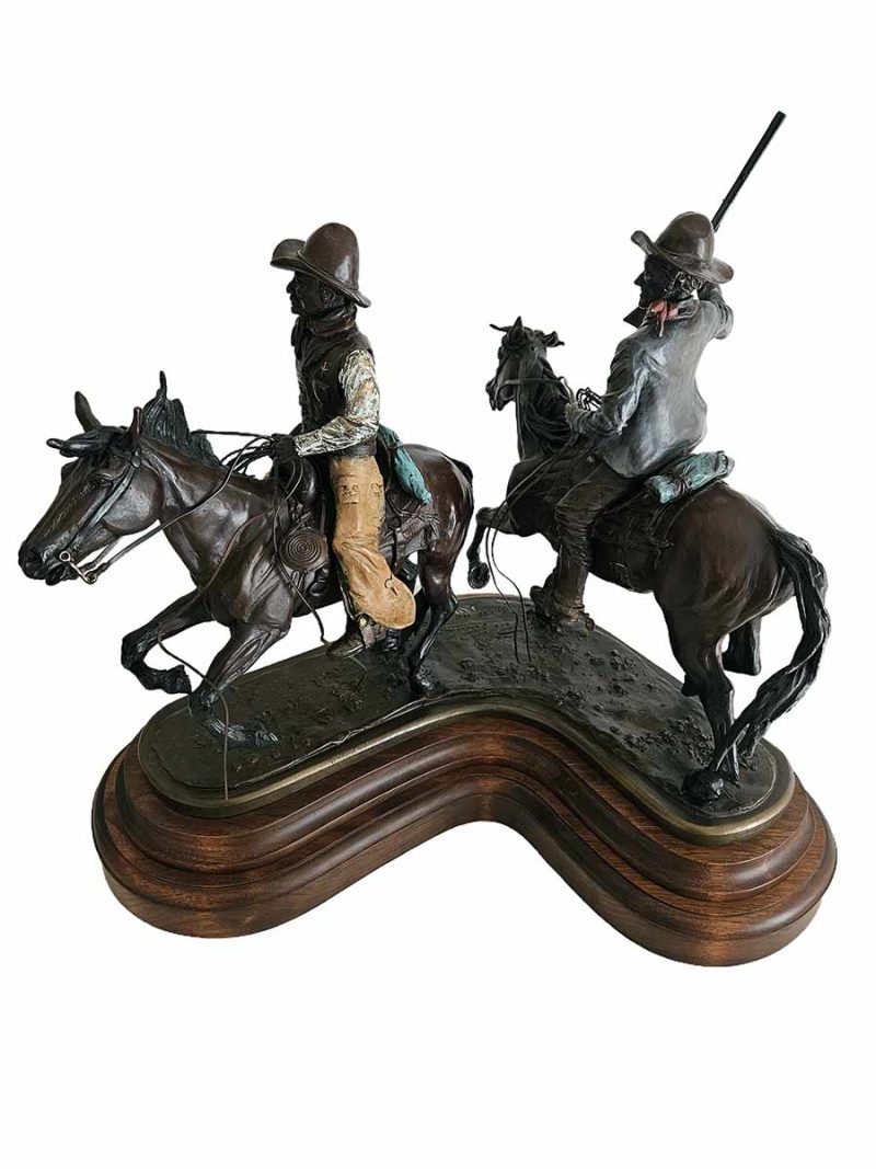 There He Goes is a rare limited edition bronze sculpture of a couple of cowboys out on the range doing what they do to round up cattle by noted sculptor-artist Bob Parks.