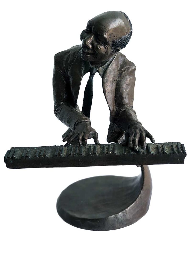 A bronze sculpture titled "Jazz Piano" by Mark Hopkins one of the pieces of the Jazz Musicians Sculpture Group by Mark Hopkins