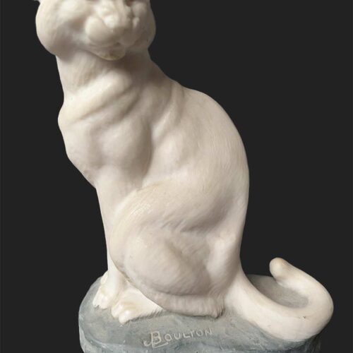 A bronze sculpture titled "Cougar"(ttb) by noted sculptor-artist JL Boulton one of his many nicely carved Alabaster sculptures.