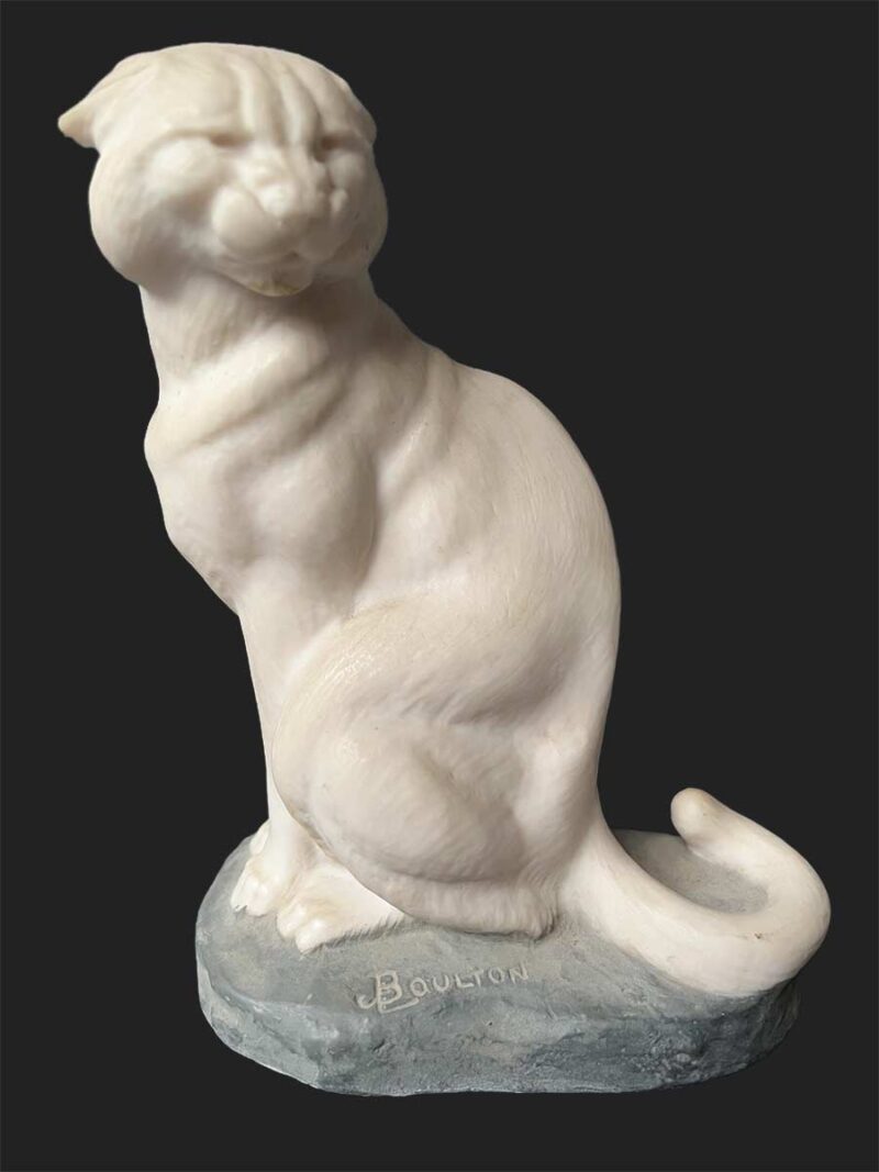 A bronze sculpture titled "Cougar"(ttb) by noted sculptor-artist JL Boulton one of his many nicely carved Alabaster sculptures.