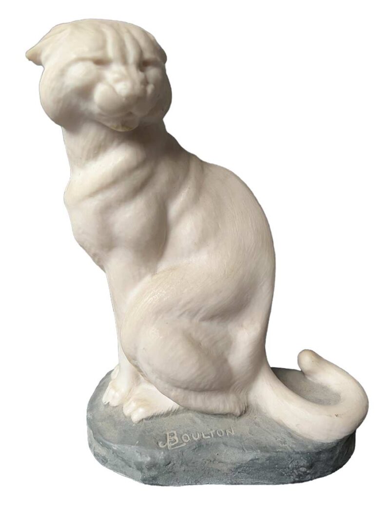 A bronze sculpture titled "Cougar"(ttb) by noted sculptor-artist JL Boulton one of his many nicely carved Alabaster sculptures.