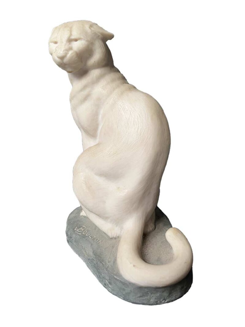 A bronze sculpture titled "Cougar"(ttb) by noted sculptor-artist JL Boulton one of his many nicely carved Alabaster sculptures.