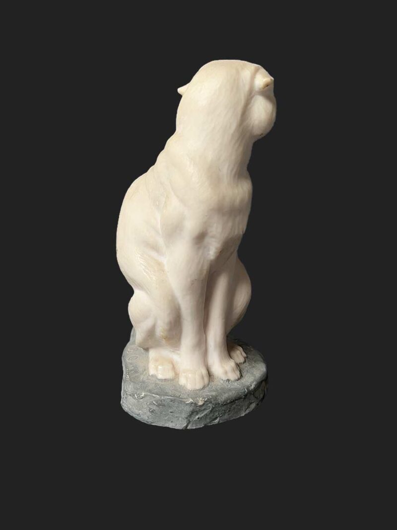 A bronze sculpture titled "Cougar"(ttb) by noted sculptor-artist JL Boulton one of his many nicely carved Alabaster sculptures.