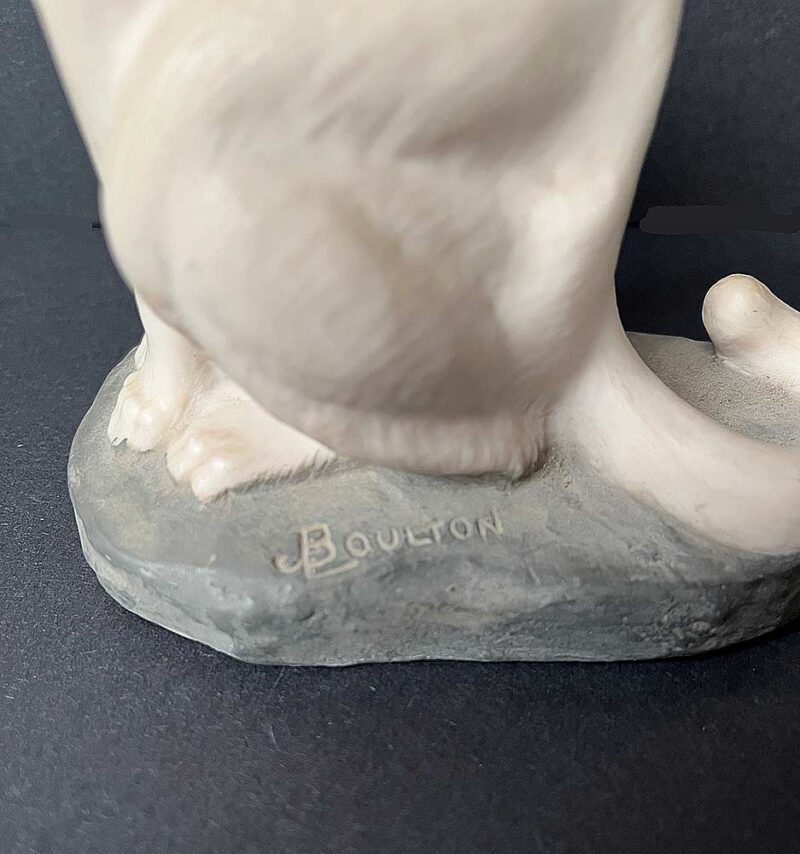 A bronze sculpture titled "Cougar"(ttb) by noted sculptor-artist JL Boulton one of his many nicely carved Alabaster sculptures.