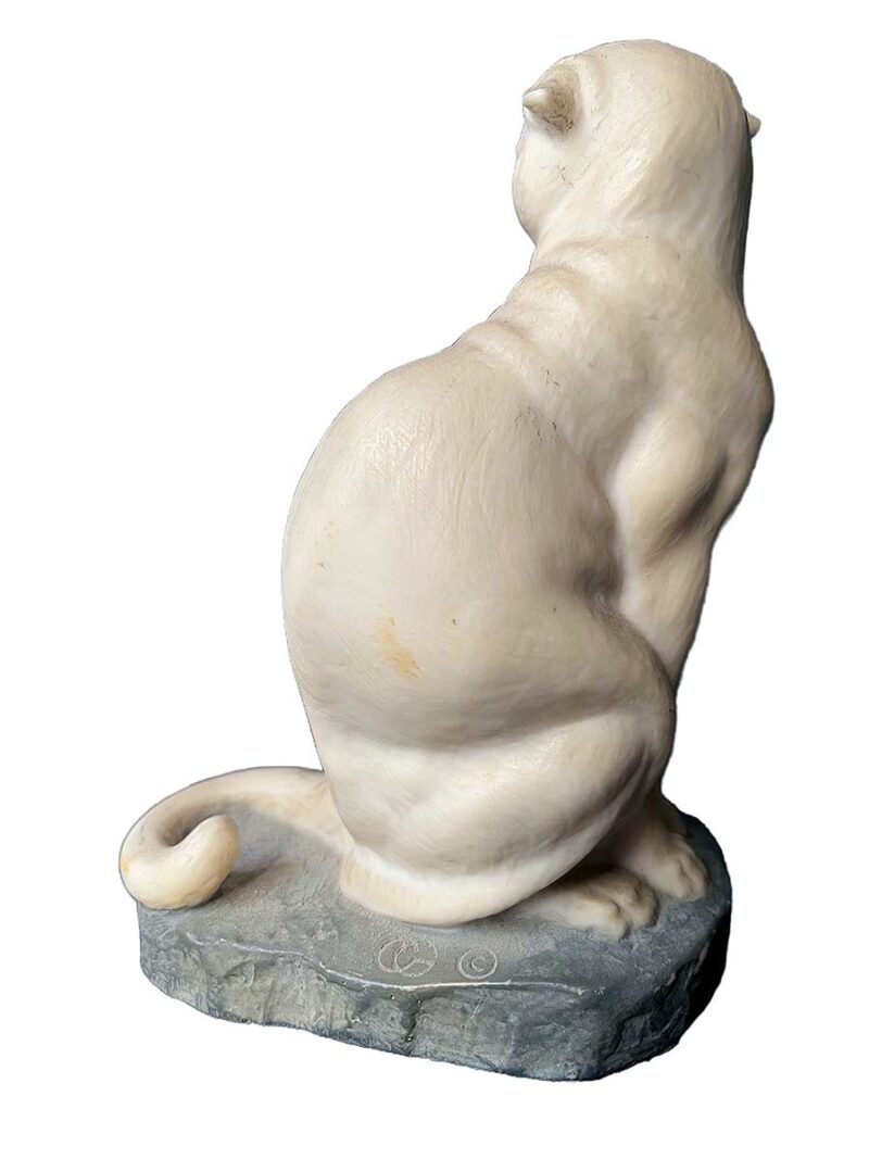 bronze sculpture titled "Cougar"(ttb) by noted sculptor-artist JL Boulton one of his many nicely carved Alabaster sculptures.