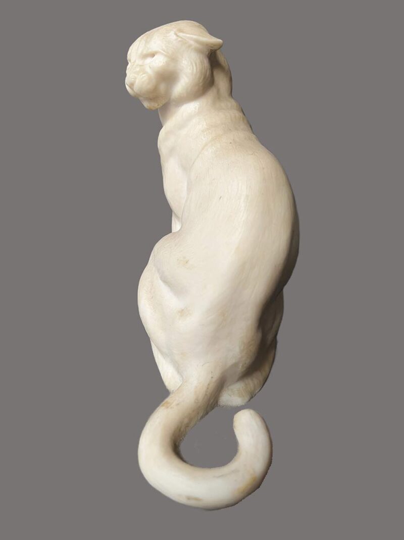 bronze sculpture titled "Cougar"(ttb) by noted sculptor-artist JL Boulton one of his many nicely carved Alabaster sculptures.