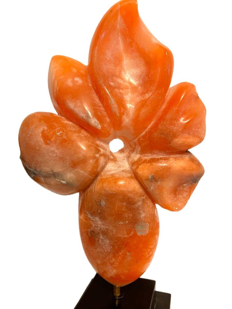 Rare Alabaster Sculpture titled Flower by Renowned Sculptor Sherrill Stone** This stunning piece, crafted from rare orange alabaster sourced from a now-closed mine in the Rocky Mountains of Colorado, is a true collector's item. Sherrill Stone, known for her monumental outdoor sculptures, rarely creates pieces suited for indoor display, making this a unique opportunity to own one of her works for your home.