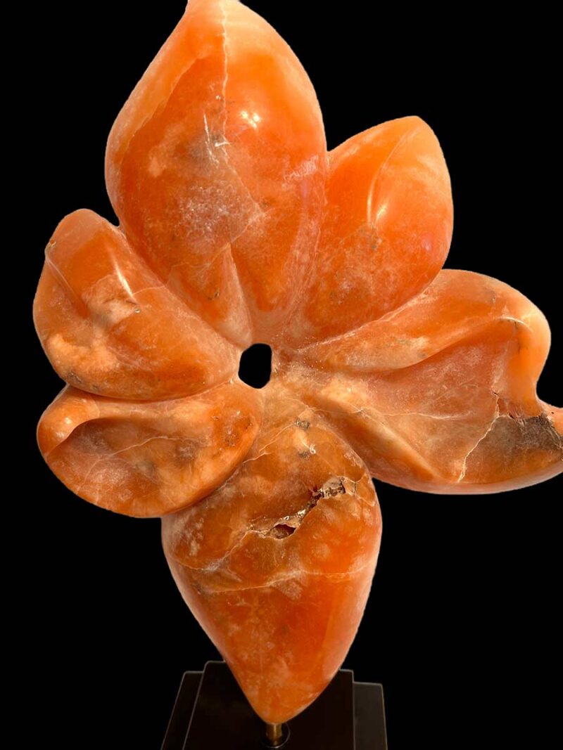 Rare Alabaster Sculpture titled Flower by Renowned Sculptor Sherrill Stone** This stunning piece, crafted from rare orange alabaster sourced from a now-closed mine in the Rocky Mountains of Colorado, is a true collector's item. Sherrill Stone, known for her monumental outdoor sculptures, rarely creates pieces suited for indoor display, making this a unique opportunity to own one of her works for your home.