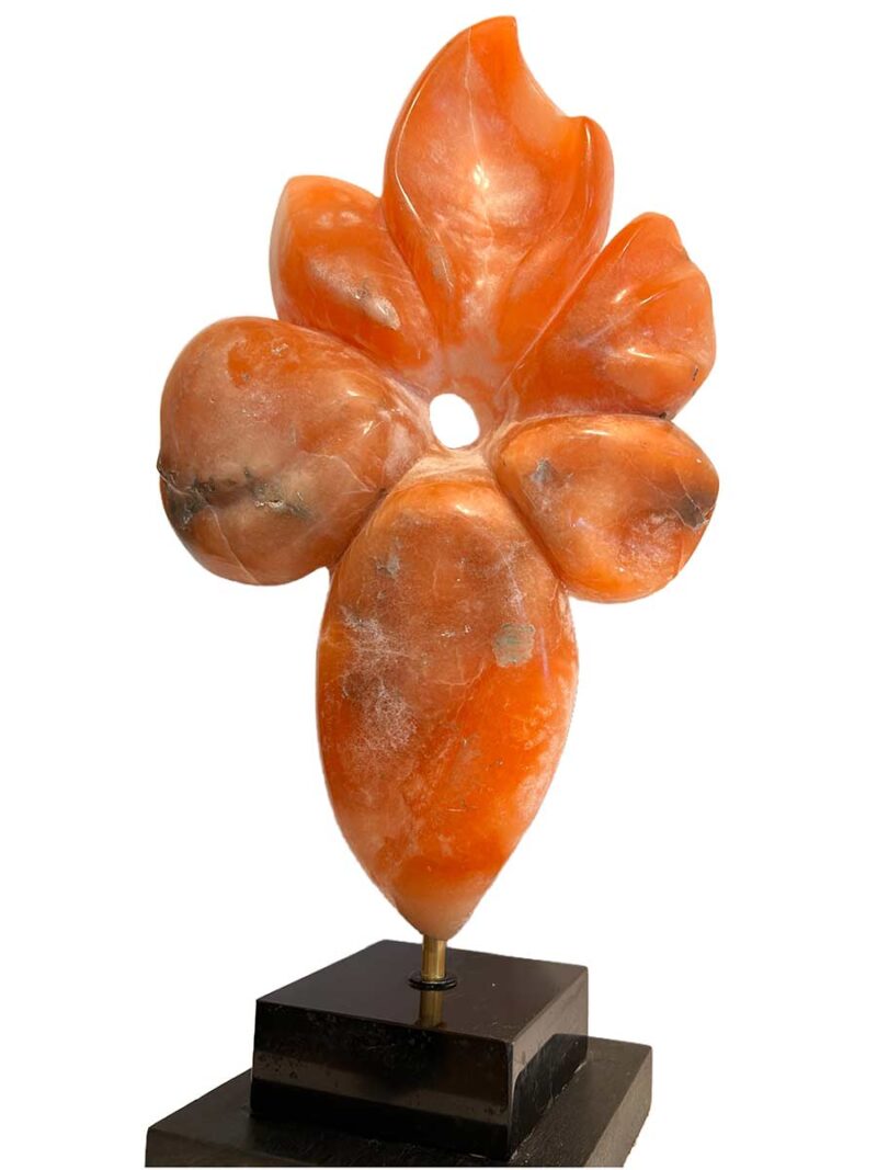 Rare Alabaster Sculpture titled Flower by Renowned Sculptor Sherrill Stone** This stunning piece, crafted from rare orange alabaster sourced from a now-closed mine in the Rocky Mountains of Colorado, is a true collector's item. Sherrill Stone, known for her monumental outdoor sculptures, rarely creates pieces suited for indoor display, making this a unique opportunity to own one of her works for your home.