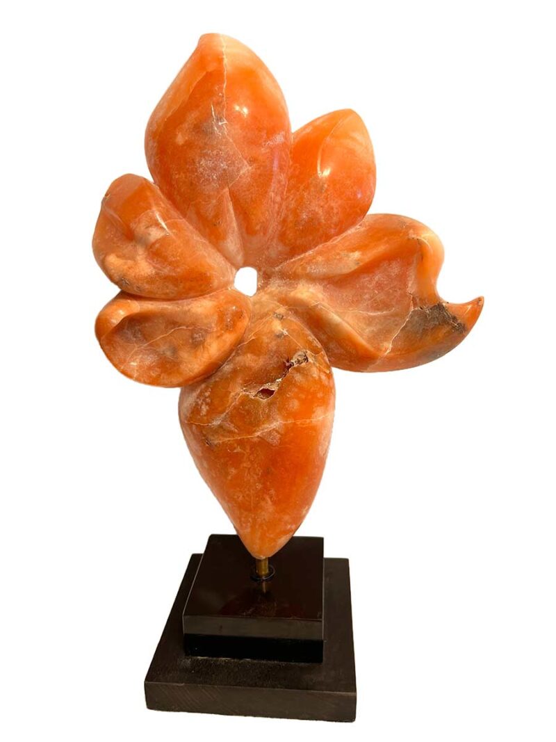 Rare Alabaster Sculpture titled Flower by Renowned Sculptor Sherrill Stone** This stunning piece, crafted from rare orange alabaster sourced from a now-closed mine in the Rocky Mountains of Colorado, is a true collector's item. Sherrill Stone, known for her monumental outdoor sculptures, rarely creates pieces suited for indoor display, making this a unique opportunity to own one of her works for your home.