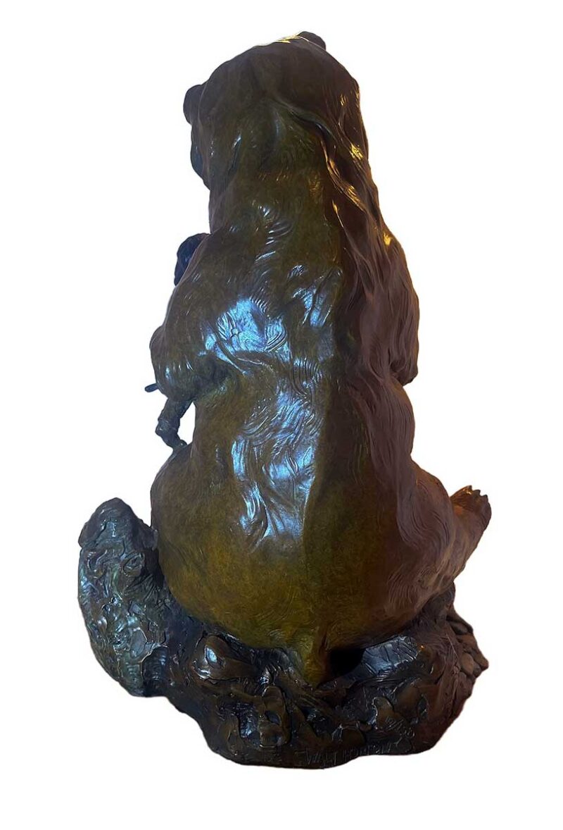 This bronze bear sculpture brings a sense of humor, complexity, and even humility to the theme of Ransom. Created by Walt Horton it features a large bear in an upright, almost human-like stance, holding a young boy in one paw and a fish has been speared by the young boy fish in the other. The scene is whimsical, suggesting that the bear is either demanding a trade for the fish or holding the fish as leverage in a humorous negotiation.