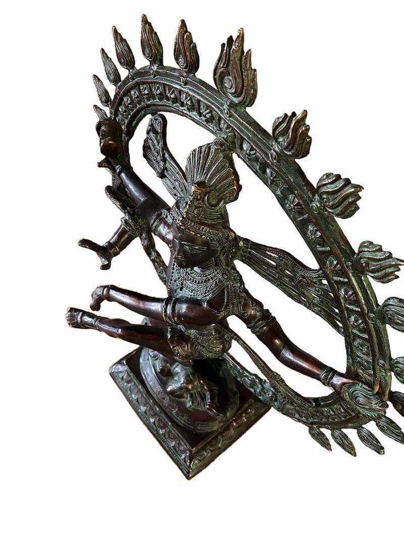 Nataraja in his cosmic dance form in a circle of fire. One of a kind statue depicting incredible details of the attributes of Nataraja using the lost wax method. Crafted by expert South Asian artisans. Measures an impressive 27" W x 11" x 34" T