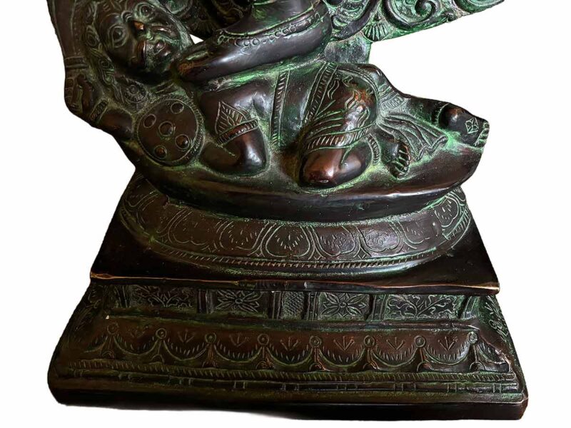 Nataraja in his cosmic dance form in a circle of fire. One of a kind statue depicting incredible details of the attributes of Nataraja using the lost wax method. Crafted by expert South Asian artisans. Measures an impressive 27" W x 11" x 34" T